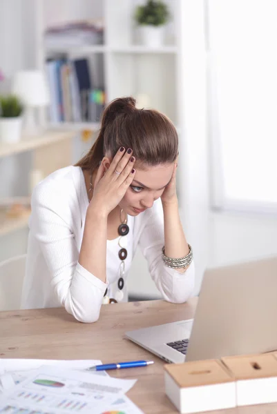 Stressed businesswoman sitting at desk — Stock Photo, Image