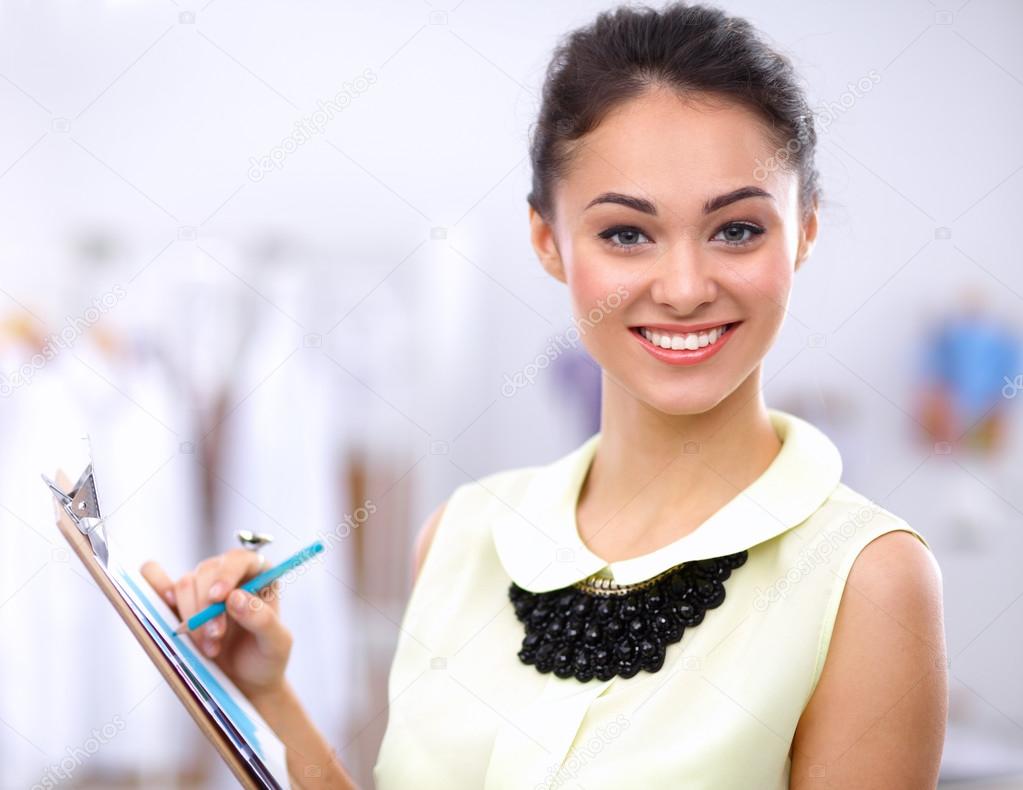 Modern young fashion designer working at studio.