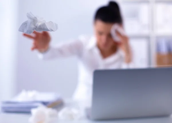 Young businesswoman blowing her nose, sits at the desk — Stock Photo, Image