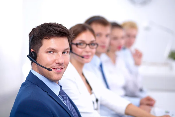 Attractive Smiling positive young businesspeople and colleagues in a call center office — Stock Photo, Image