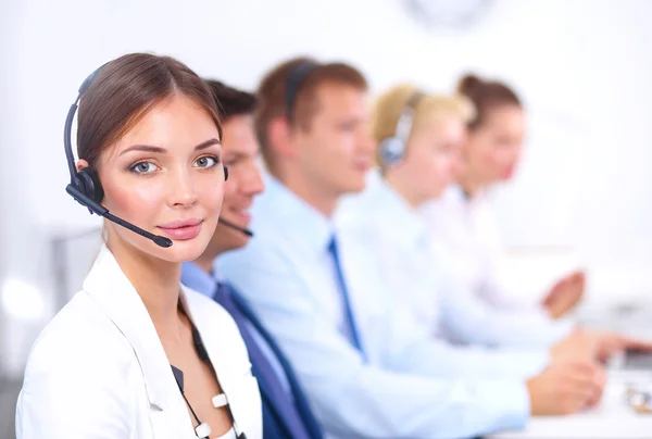 Attractive Smiling positive young businesspeople and colleagues in a call center office — Stock Photo, Image