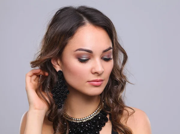 Portrait of a beautiful woman with necklace — Stock Photo, Image