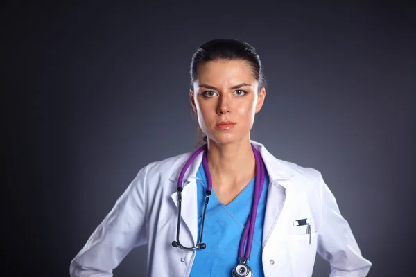 Mujer doctora joven con estetoscopio aislado en gris —  Fotos de Stock