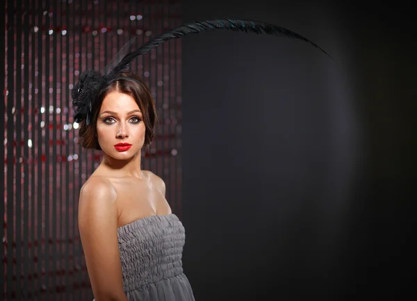 Portrait of beautiful young woman face. Isolated on dark background — Stock Photo, Image