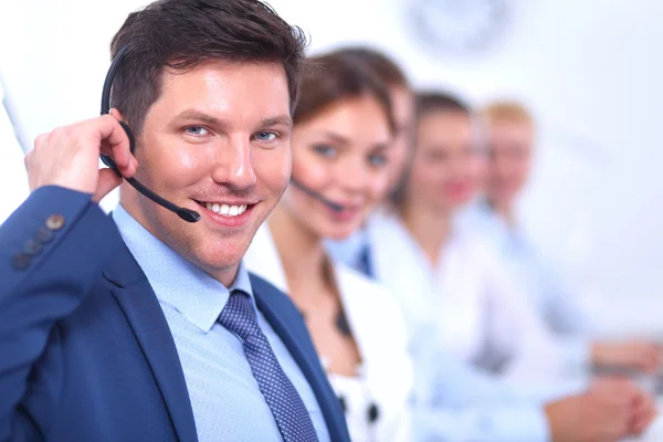 Attractive Smiling positive young businesspeople and colleagues in a call center office — Stock Photo, Image