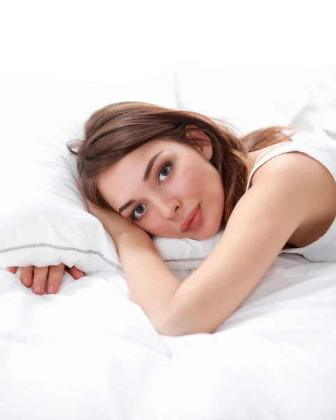 Beautiful girl lying in bedroom at early morning — Stock Photo, Image