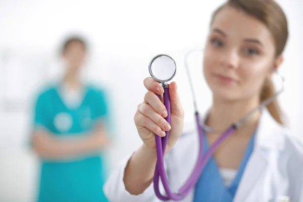 Female doctor with a stethoscope listening — Stock Photo, Image