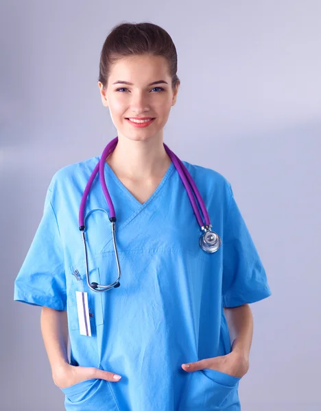 Portrait of young woman doctor standing in hospital — Stock Photo, Image