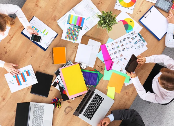 Business people sitting and discussing at business meeting, in office — Stock Photo, Image