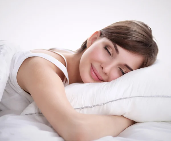 Beautiful girl sleeps in the bedroom, lying on bed — Stock Photo, Image