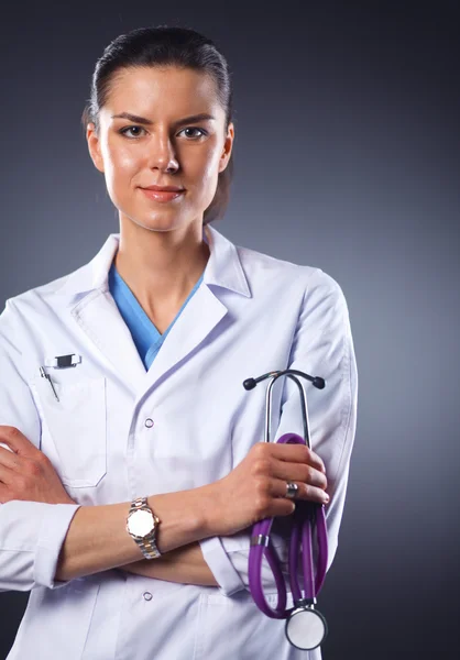 Young doctor woman with stethoscope isolated on grey — Stock Photo, Image