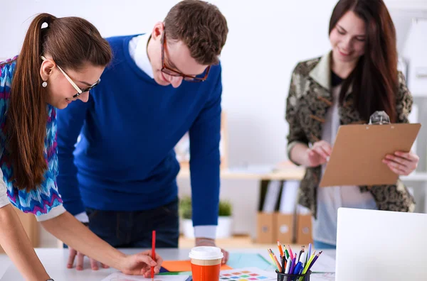 Young business people working at office on new project — Stock Photo, Image