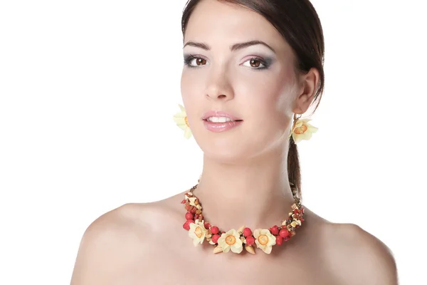 Portrait of young beautiful brunette woman in beads — Stock Photo, Image