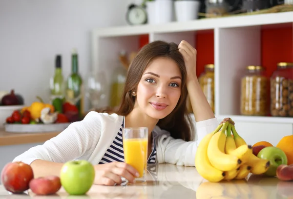 Portrait of a pretty woman holding glass with tasty juice — Stock Photo, Image