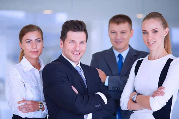 Smiling successful business team standing in office — Stock Photo, Image