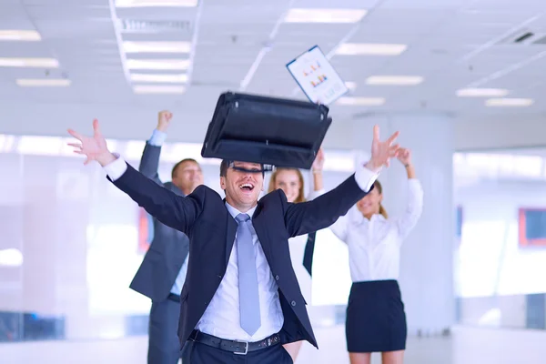 Business team celebrating a triumph with arms up — Stock Photo, Image