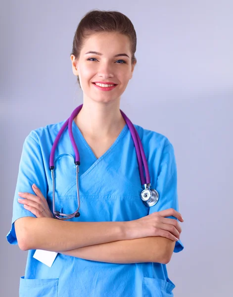 Portrait of young woman doctor standing in hospital — Stock Photo, Image