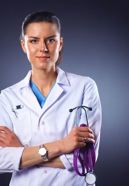 Young doctor woman with stethoscope isolated on grey — Stock Photo, Image