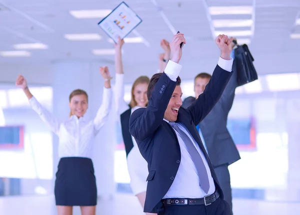 Business team celebrating a triumph with arms up — Stock Photo, Image