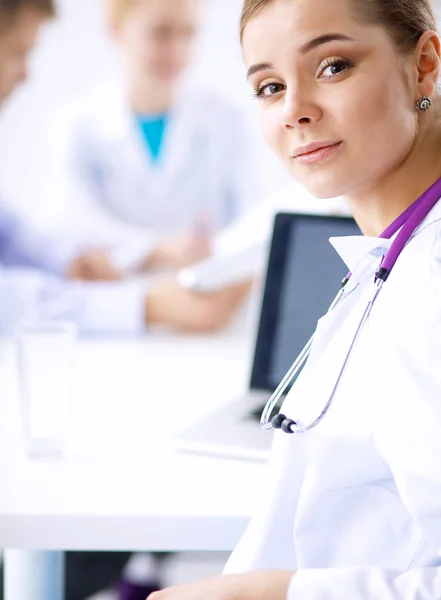 Medical team sitting at the table in modern hospital — Stock Photo, Image