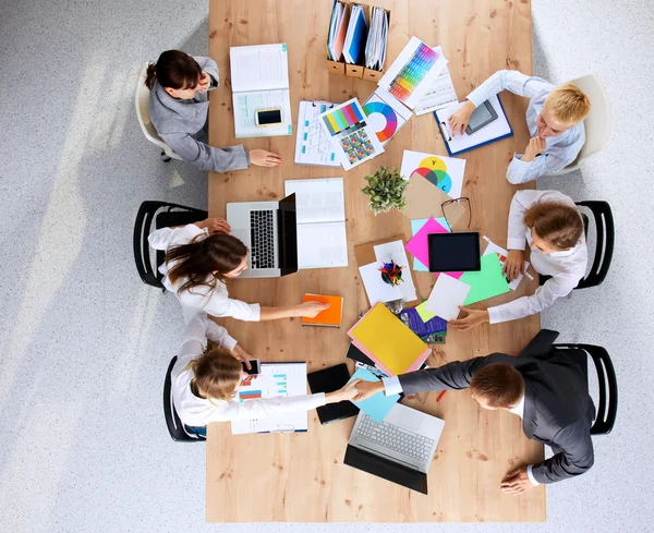 Business people sitting and discussing at business meeting, in office — Stock Photo, Image