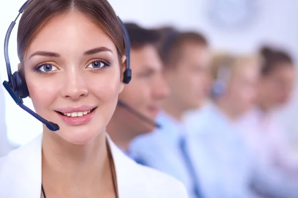 Attractive Smiling positive young businesspeople and colleagues in a call center office — Stock Photo, Image