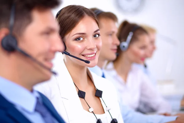 Attractive Smiling positive young businesspeople and colleagues in a call center office — Stock Photo, Image