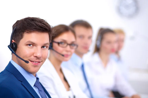 Attractive Smiling positive young businesspeople and colleagues in a call center office — Stock Photo, Image