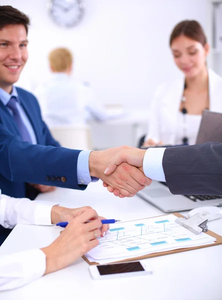 Business people shaking hands, finishing up a meeting, in office — Stock Photo, Image