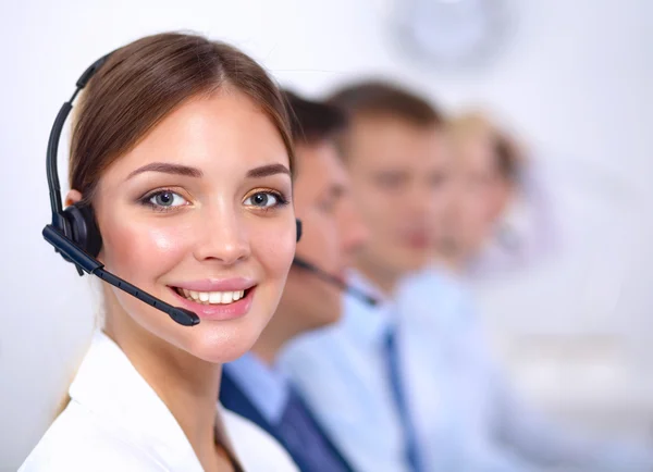 Attractive Smiling positive young businesspeople and colleagues in a call center office — Stock Photo, Image