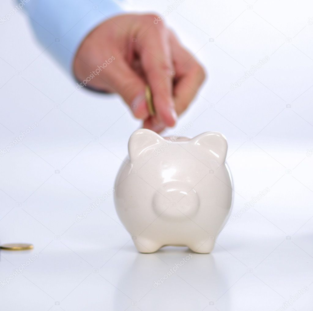 People putting coin into the piggy bank