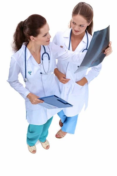 Two woman nurse watching X Ray image, standing in hospital — Stock Photo, Image