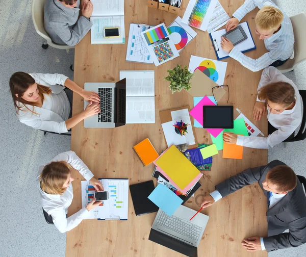 Business people sitting and discussing at business meeting, in office — Stock Photo, Image