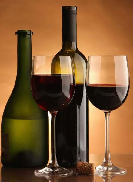 A glass of wine and a bottle — Stock Photo, Image