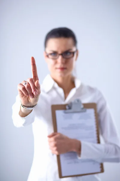 Woman touching an imaginary screen with her finger — Stock Photo, Image