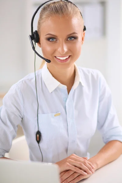 Close-up portrait of a customer service agent sitting at office — Stock Photo, Image