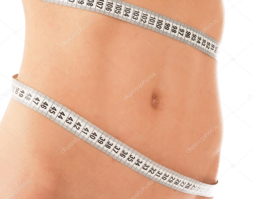 woman measure her waist belly by metre-stick.