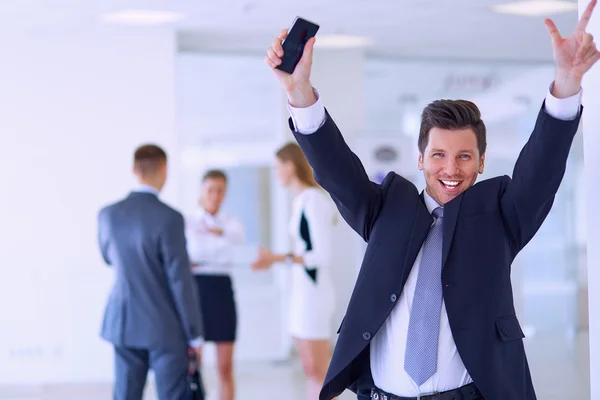 Business team celebrating a triumph with arms up — Stock Photo, Image