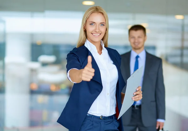 Successful young businesswoman showing ok — Stock Photo, Image