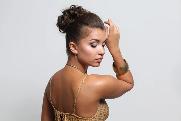 Young woman wearing a beige dress standing — Stock Photo, Image