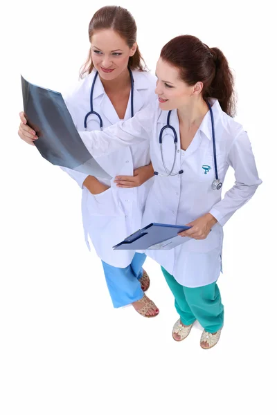 Two woman nurse watching X Ray image, standing in hospital — Stock Photo, Image