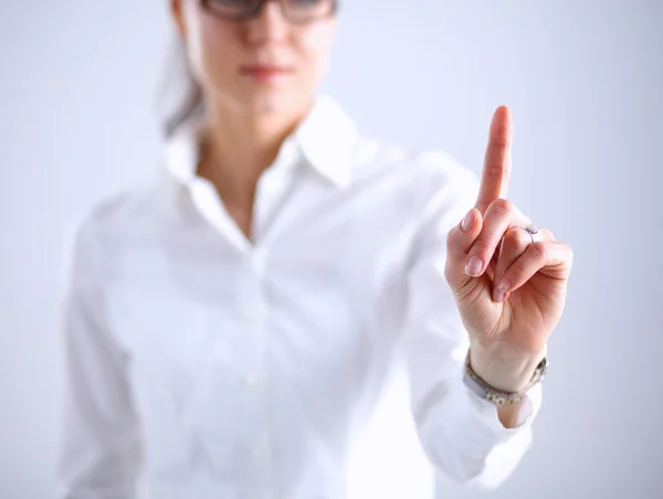 Kvinnan vidrör en imaginär skärm med fingret — Stockfoto