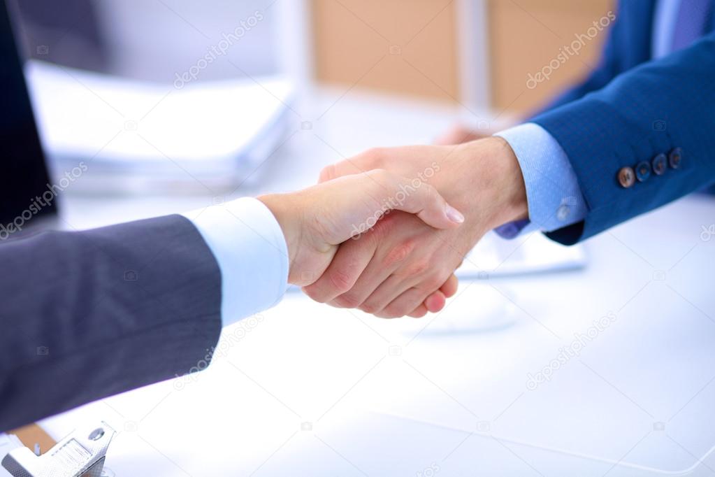 Business people shaking hands, finishing up a meeting