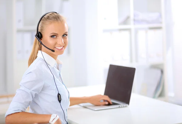 Close-up portrait of a customer service agent sitting at office — Stock Photo, Image