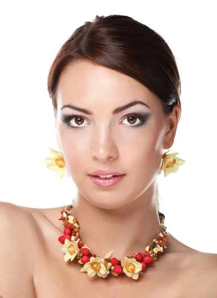 Portrait of young beautiful brunette woman in beads — Stock Photo, Image