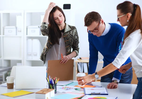 Young business people working at office on new project — Stock Photo, Image