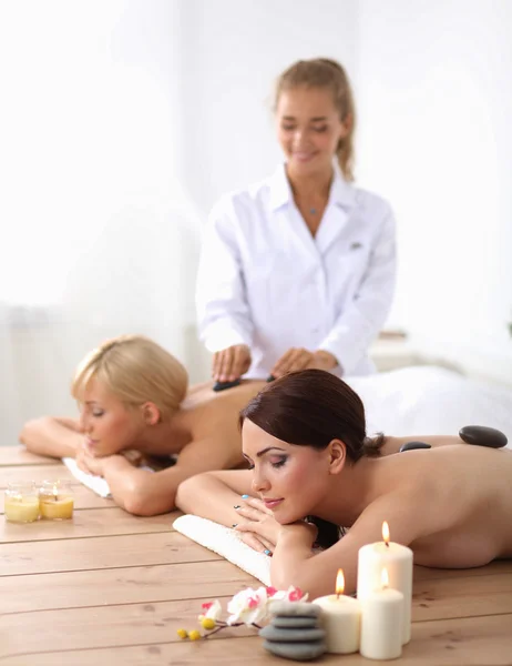 Two young beautiful women relaxing and enjoying at the spa center — Stock Photo, Image