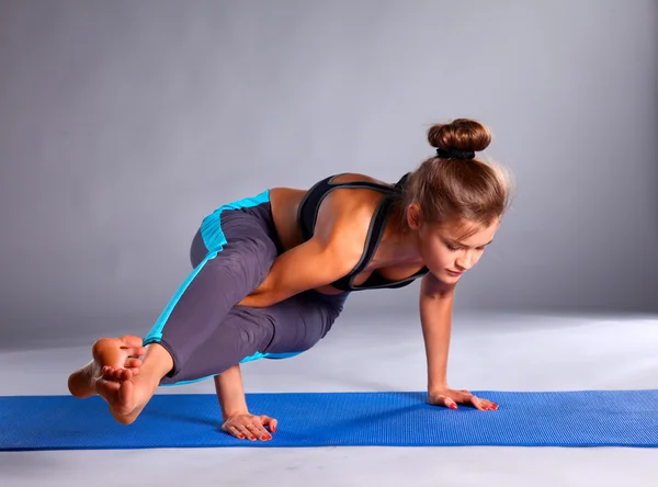 Portrait of sport girl doing yoga stretching exercise — Stock Photo, Image