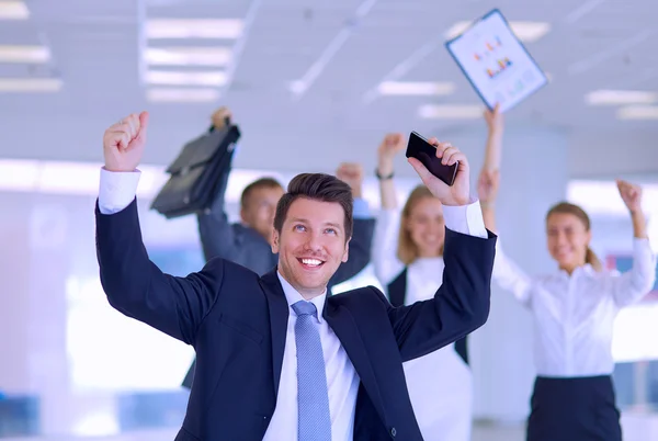 Business team celebrating a triumph with arms up — Stock Photo, Image