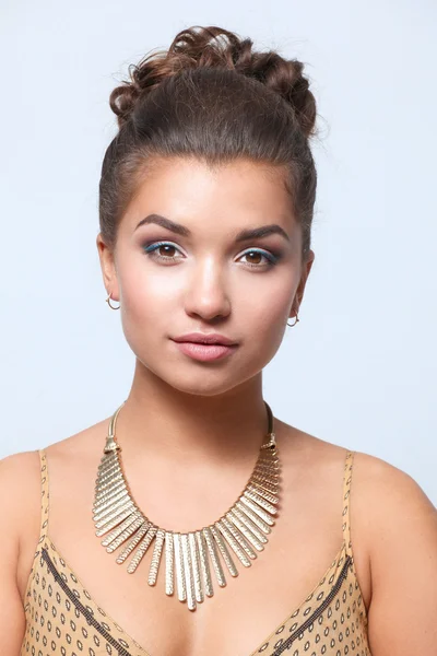 Young woman wearing a beige dress standing — Stock Photo, Image